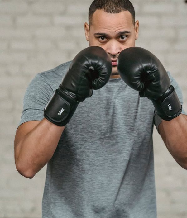 Man in a focused power stance, symbolizing inner strength and control.